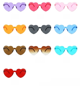 Detail view of heart-shaped rimless sunglasses in ten vibrant candy jelly colors