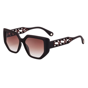 Women cat eye sunglasses with hollow lattice temples and brown gradient lenses