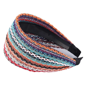 Wide headband with colorful woven stripes in blue and orange for a stylish hair accessory
