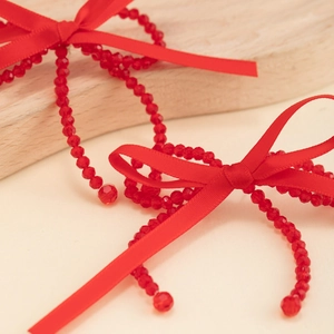 Elegant red silk ribbon bow earrings with faceted crystal beads and pearl tassels