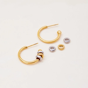 Detail of minimalist 18K gold-plated stainless steel C-shape earrings with mixed beads