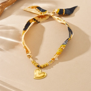 Vintage gold heart pendant necklace with elegant floral print silk ribbon strap