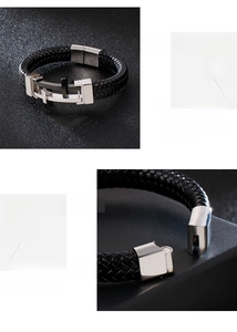 Detail of braided leather bracelet with embossed silver metal cross clasp mechanism