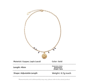 Detailed specs of gold brass necklace with lapis lazuli beads and sunburst charm pendant