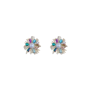 French vintage gold flower earrings with crystals and central pearls on white background