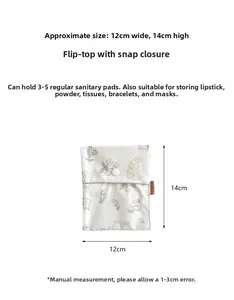 Detail of floral pouch showing snap button closure and compact 12cm width size