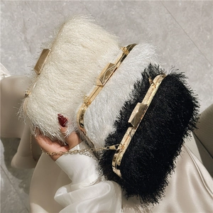 Elegant acrylic evening clutch bag with feather tassels and golden chain for women