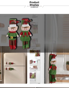 Detail of Christmas elf refrigerator handle covers with red and green bells decor