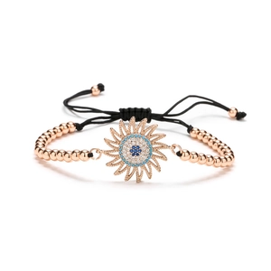 Rose gold sunflower bracelet with blue zircons and adjustable black braided cord