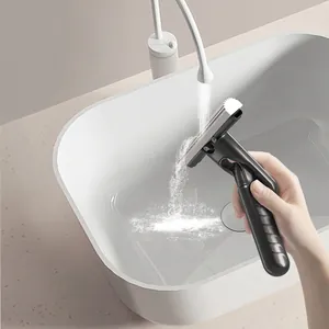 Ergonomic pet hair removal brush with easy-clean retractable bristles shown under running water