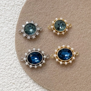 Detail of 18k gold plated charms with zircons and pearls for DIY jewelry making
