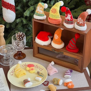 Miniature knitted Christmas hats and gloves in various colors for DIY holiday decor