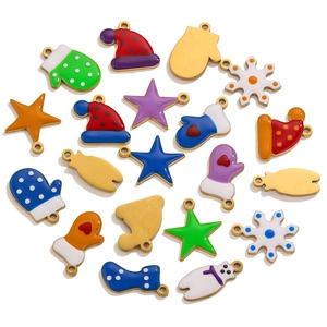 Detail of colorful enamel Christmas charms including snowflake and star designs