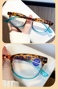 Detail view of anti-blue light reading glasses with stylish tortoiseshell and blue frame