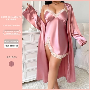 Detail of pink imitation silk nightgown with lace trim and matching bathrobe