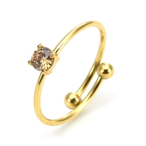Detail of adjustable gold ring featuring a champagne round-cut stone in four-prong setting