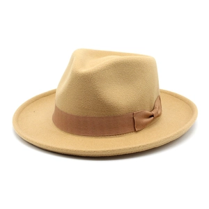 Close-up of the thick wool felt fedora with a dark brown grosgrain ribbon and bow detail