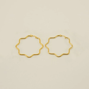 Detailed close-up of geometric star-shaped 18K gold plated stainless steel hoop earrings