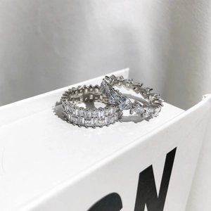 Detail of S925 silver ring set featuring heart and baguette cut cubic zirconia stones
