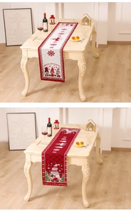 Detailed knitted Christmas table runner featuring festive gnome and reindeer jacquard patterns