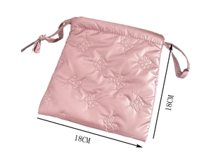 Macro shot of pink quilted bow drawstring storage bag with 18cm dimension label