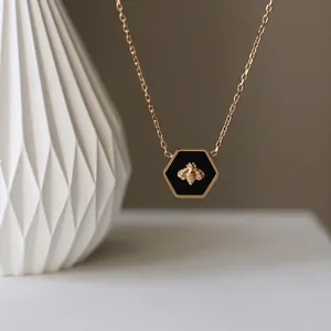 Vintage 18K gold-plated titanium steel honeycomb bee necklace with black hexagon pendant