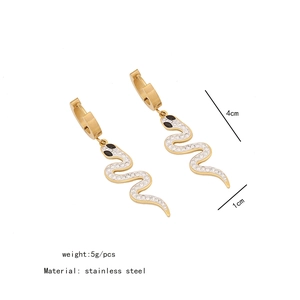 Detail view of gold snake earrings in stainless steel with white crystals and measurements