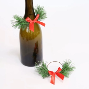 Christmas pine needle napkin rings with red silk bows for wine bottle decor