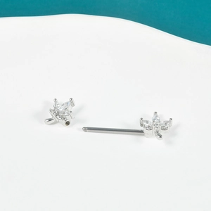 Detail of silver nipple bar featuring dragonfly charms with micro-pave cubic zirconia