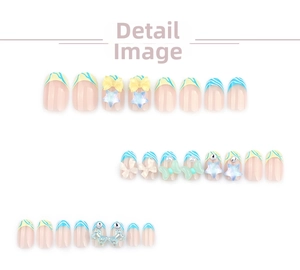 Detailed view of blue French striped press-on nails with 3D bows and star charms