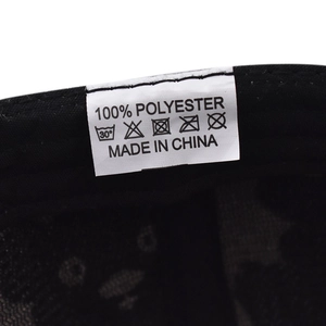 Close-up of 100% polyester washing label and inner stitching on cartoon bear baseball cap