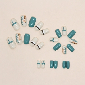 Cute giraffe and leaf pattern press-on nails in mint green and cream white glossy finish