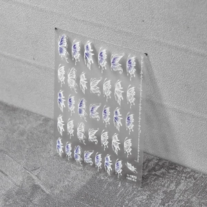 5D butterfly nail art stickers with white and purple gradients on a clear sheet