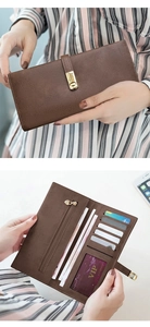 Detailed interior of a brown leather long wallet featuring card slots and photo window