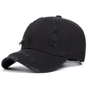 Vintage black distressed baseball cap with ripped details and a classic curved brim design