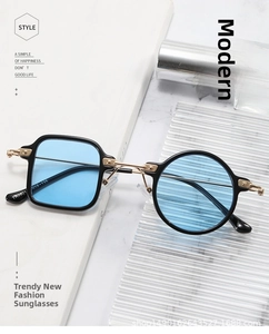 Detail of asymmetric black frames with blue lenses and gold metal bridge TR9951