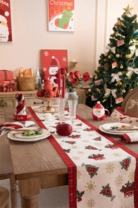 Detailed view of jacquard table runner with festive Christmas tree and snowflake patterns