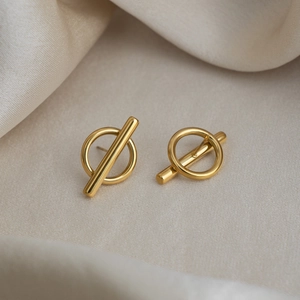 Minimalist 18K gold plated stainless steel irregular geometric stud earrings on silk