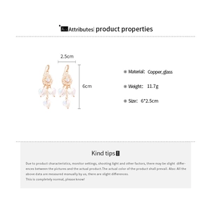 Detail showing crystal heart tassel earrings with copper chain dimensions and weight