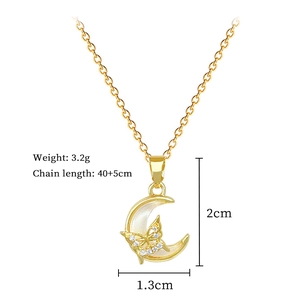 Macro detail of crescent moon pendant necklace with butterfly zircon and size parameters
