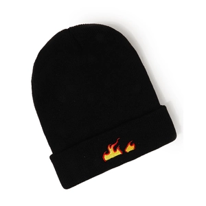 Close-up detail of flame embroidery on black ribbed knit beanie for winter warmth