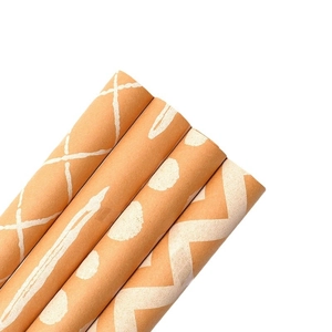 Kraft paper gift wrapping rolls with classic brown and white geometric patterns