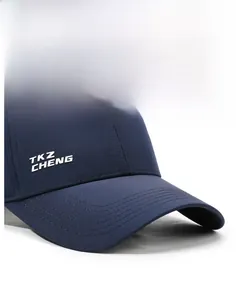 Detail of navy blue quick-dry cap showing reinforced stitching and brand logo