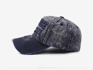 Close-up of vintage washed denim baseball cap featuring distressed brim and GTE 1978 embroidery