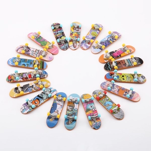Top view of a diverse collection of mini alloy finger skateboards with colorful graffiti art