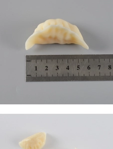 Detailed view of a 55mm realistic PVC dumpling model with life-like texture and scale