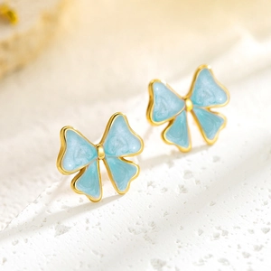 Elegant gold-plated bow earrings with light blue marble enamel for women