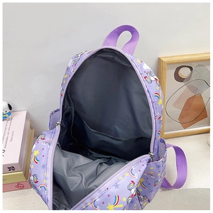 Detail view of the purple unicorn backpack interior showing main compartment and sleeve