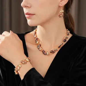 Vintage enamel jewelry set with red and black teardrop pendants for elegant women