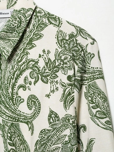 Detailed macro shot of paisley print cotton linen shirt collar with green pattern